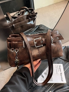 Retro brown leather tote bag with vintage texture and silver buckle for autumn fashion