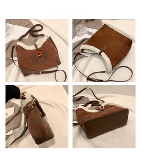Close-up detail of plush suede dumpling bag with horn buckle and adjustable strap