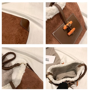 Detail view of winter brown suede bucket bag with white faux shearling trim and toggle button