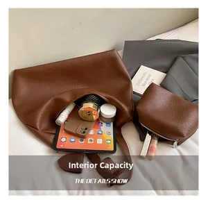 Deep brown lychee grain leather tote bag showing large capacity for tablet and phone