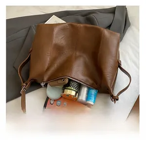 Interior view of large brown vintage tote bag showing ample space for tablet and essentials