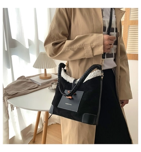 Detail of plush tote bag showing contrast faux fur trim and toggle closure detail
