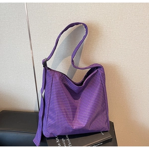 Detail view of purple plaid oxford shoulder bag with adjustable strap and check pattern