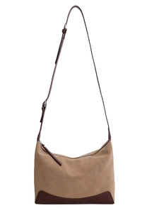 Vintage khaki canvas shoulder bag with brown leather straps and spacious design