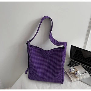 Detail shot of purple plaid oxford tote bag featuring adjustable strap and spacious interior