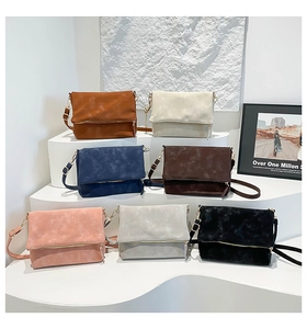 Detailed display of vintage-style square envelope bags in seven minimalist colors