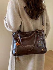 Retro dark brown leather tote bag with vintage stitching and shoulder strap for women