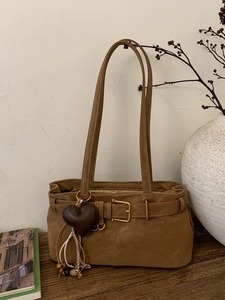 Retro brown faux leather shoulder bag with decorative metal buckle and heart pendant
