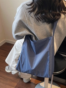 Blue plaid oxford tote bag featuring a spacious design for casual daily commuting