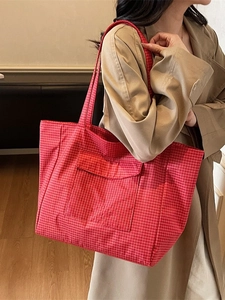 Red plaid canvas tote bag with front pocket and double straps for daily commute