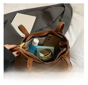 Internal view of leopard bucket bag showing spacious storage for daily makeup items