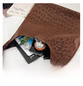 Macro shot showing large storage capacity of the leopard print tote bag with daily items