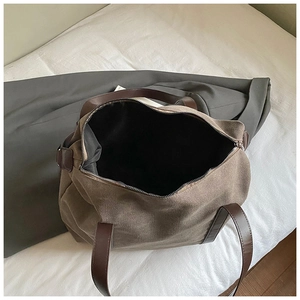 Top view of large canvas tote bag showing spacious interior and brown leather handles