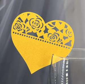 Golden glitter heart place card with hollow rose laser cut design on glass rim