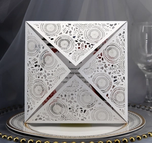Detailed laser-cut sunflower pattern on a white pearlescent square wedding invitation card
