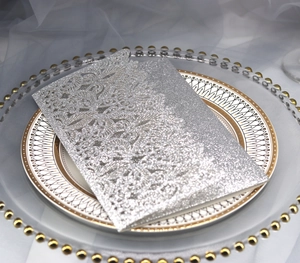 Silver glitter invitation card with laser-cut European floral patterns on decorative trays
