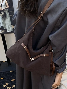 Minimalist large brown hobo tote bag in suede texture with adjustable leather shoulder strap