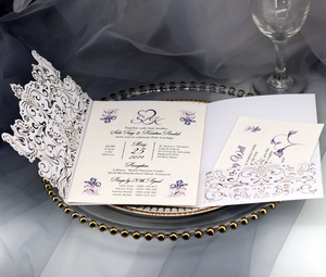 Laser cut wedding invitation set with elegant white hollow patterns and floral cards