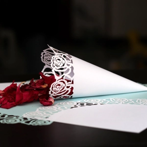 Laser cut white paper wedding petal cones with elegant rose lace design for confetti