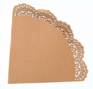 Macro detail of kraft paper wedding petal cone with intricate laser-cut lace edge design