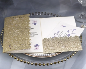 Detail of rose gold glitter laser-cut wedding invitation with elegant floral inner card