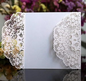 Elegant laser cut lace wedding invitation cover in white pearlescent paper finish