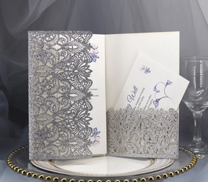 Elegant laser cut silver glitter wedding invitation set with floral hollow lace details