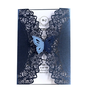 Detailed laser-cut floral wedding invitation with blue lace sleeve and butterfly cutout