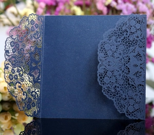 Elegant navy blue laser-cut lace wedding invitation cover in shimmering pearl paper