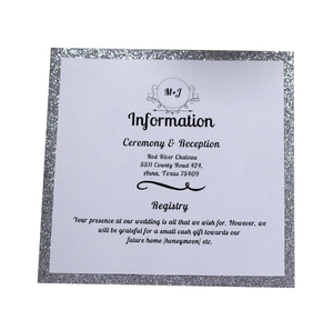 Detail of square wedding invitation card with a shimmering silver glitter border and text