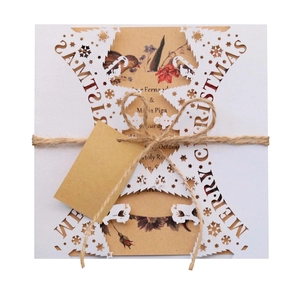 Laser cut snowflake Christmas greeting card with Merry Christmas text and twine string