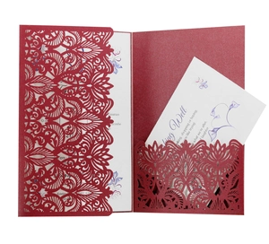 Laser cut deep red wedding invitation suite with floral patterns and white inner card