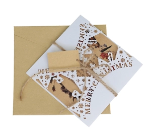 Detailed laser-cut Merry Christmas card set with botanical insert and kraft envelope
