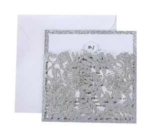 Silver glitter laser-cut floral wedding invitation set with printed card and white envelope