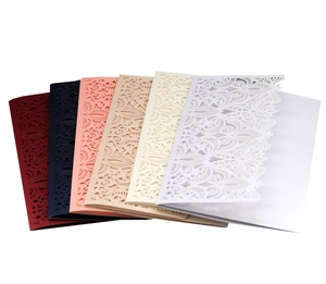 Detailed laser-cut floral invitation set in navy, burgundy, and ivory cardstock