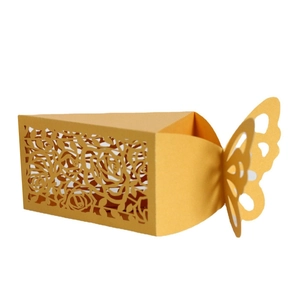 Detail of laser-cut rose patterns and butterfly closure on yellow candy gift box