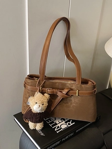 Retro leopard print bucket bag in brown faux leather with a cute plush bear charm