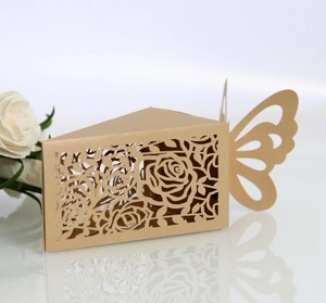 Close-up of laser-cut rose patterns on a kraft paper butterfly candy gift box
