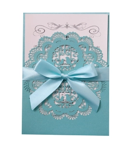 Elegant laser-cut lace wedding invitation with light blue pearl paper and satin bow