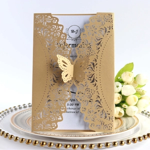 Elegant gold laser-cut wedding invitation featuring a 3D butterfly and white roses