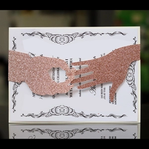 Elegant rose gold glitter laser cut wedding invitation with romantic ring exchange band