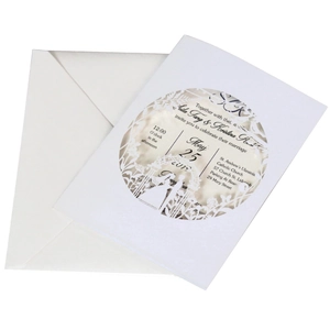 Elegant laser cut wedding invitation set with white envelope and detailed card