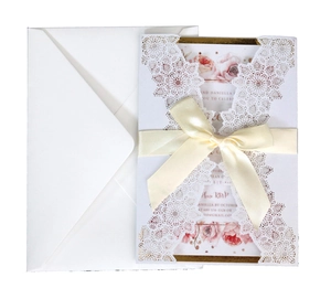 Blue laser cut invitation card set with white envelope and elegant ribbon bow