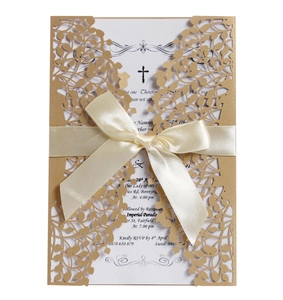 Laser cut hollow wedding invitation with teal leaf patterns and a silk bow decoration