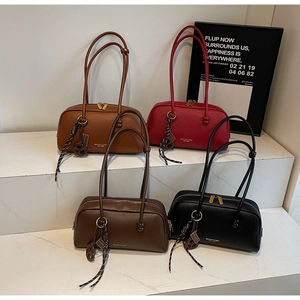 Retro bowling bag collection in four colors with pebbled leather and dual zip closure
