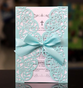 Elegant laser cut light blue wedding invitation with ribbon bow and inner card details