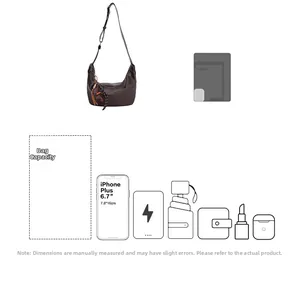 Spacious dark brown crescent bag showing internal capacity for phone, umbrella and cosmetics
