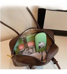 Detailed interior view of a dark brown bowling bag showing its large storage capacity