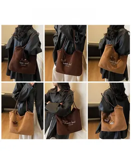 Chic embroidered faux suede tote bag shown on model with multiple color options