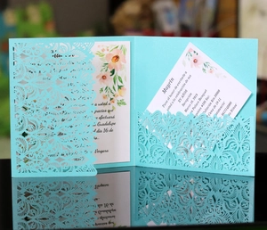 Elegant Tiffany blue laser-cut wedding invitation with lace patterns and floral inserts